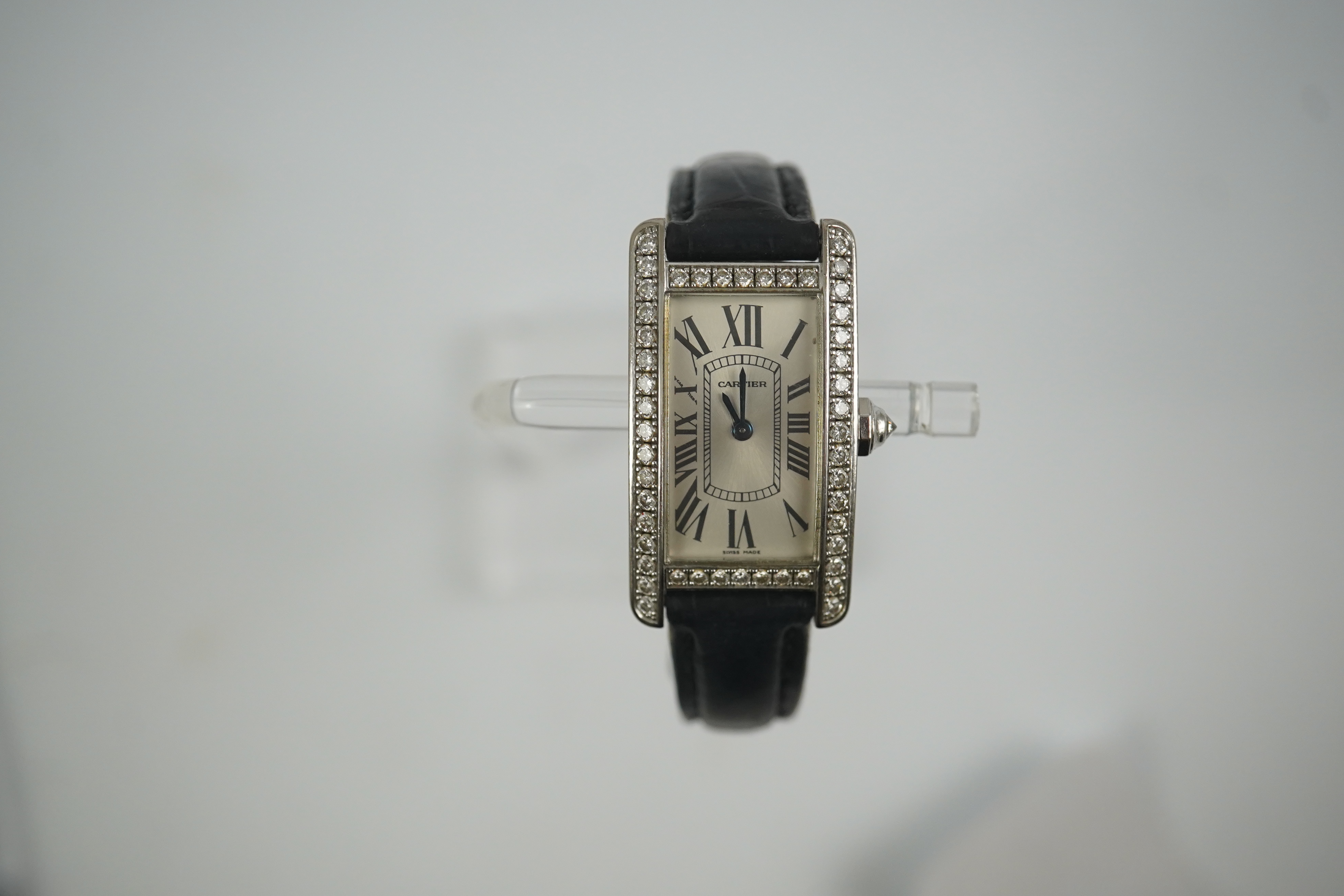 A lady's modern 18ct white gold and diamond set Cartier Tank Americaine quartz wrist watch